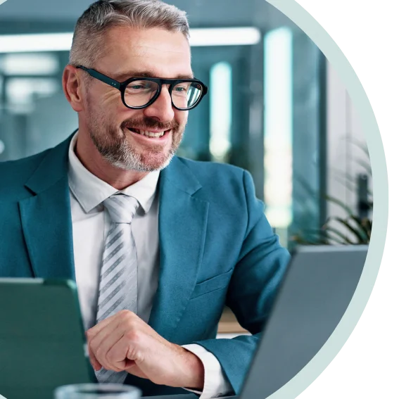 Agent smiling and wearing glasses